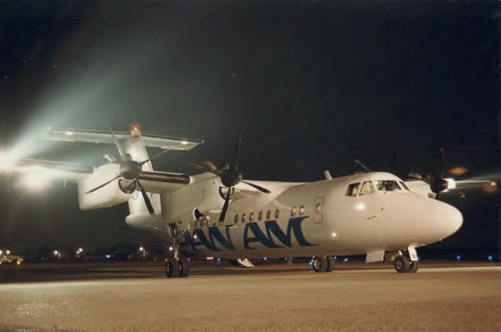 PanAm Express Dash 7 on ground from right forward, night shot.